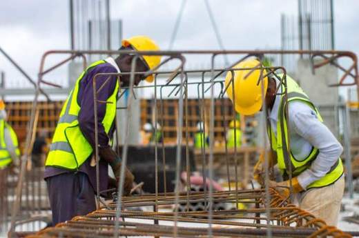 Workers assembling reinforcement steel